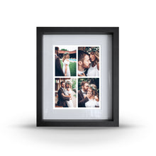 A wooden frame with a glass front, containing four small portrait images within it.